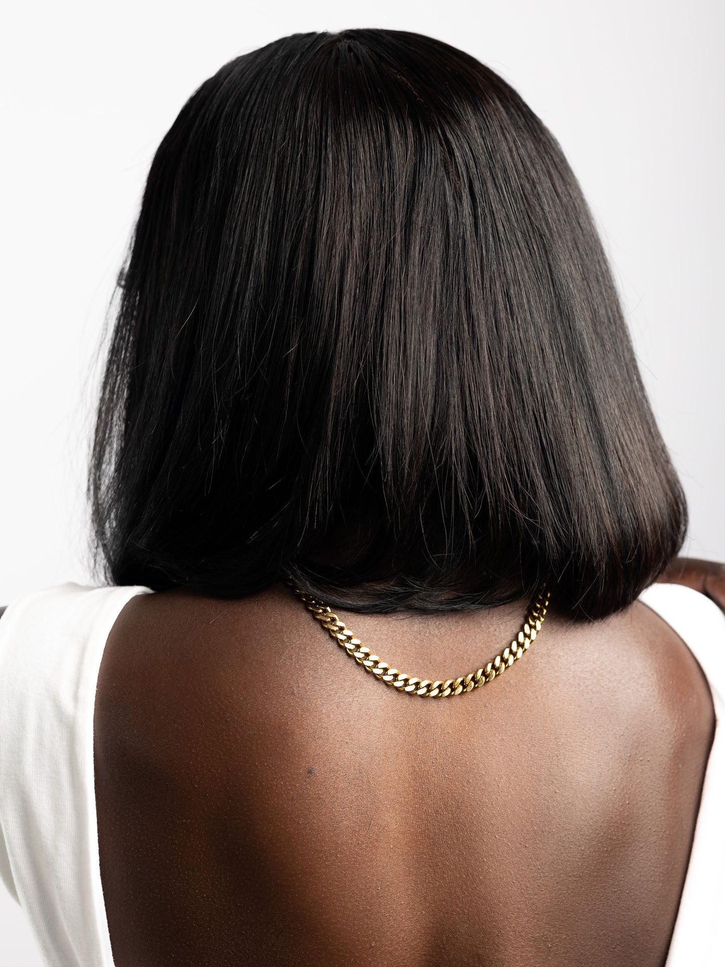 the best cuban link chain modelled by woman with a black bob