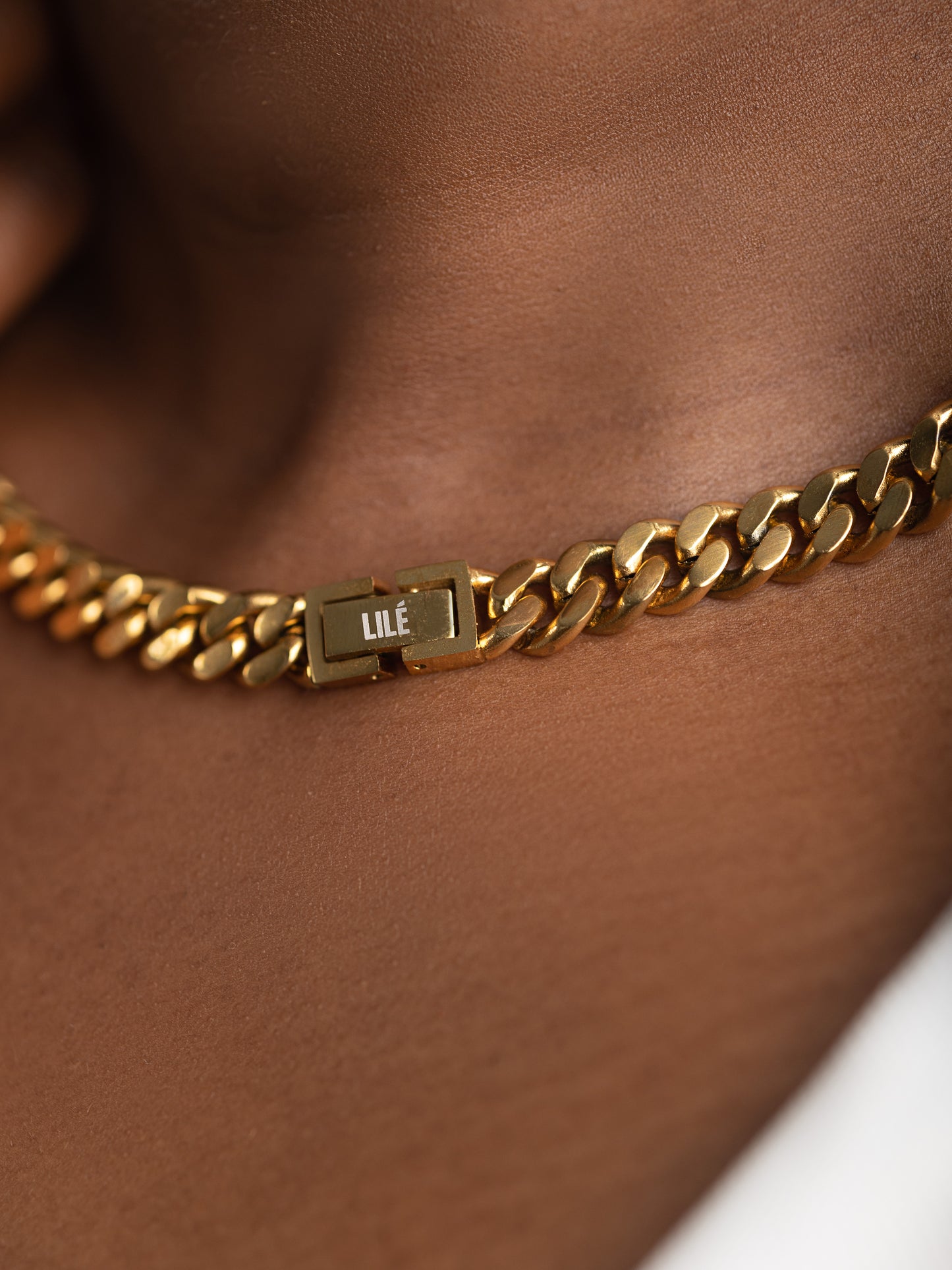 very up close image of CUBAN LINK CHAIN 18K GOLD on model