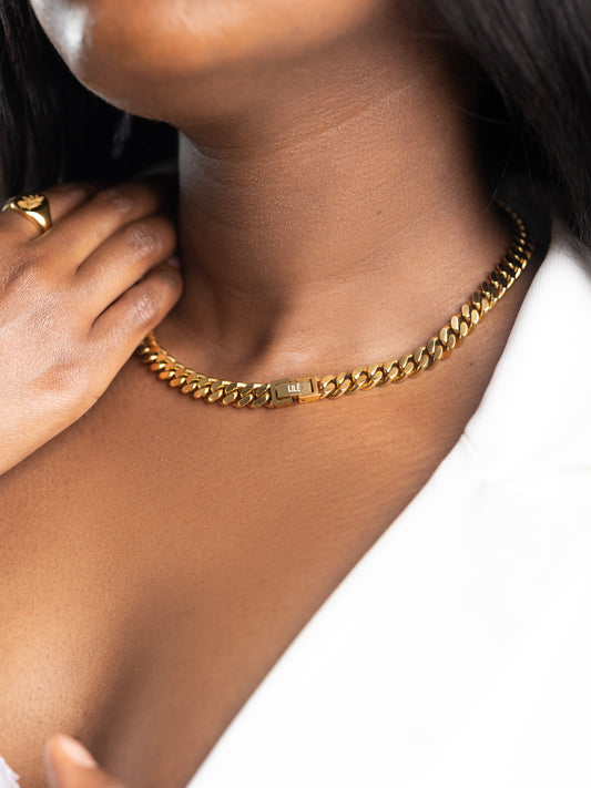 Model wearing CUBAN LINK CHAIN 18K GOLD